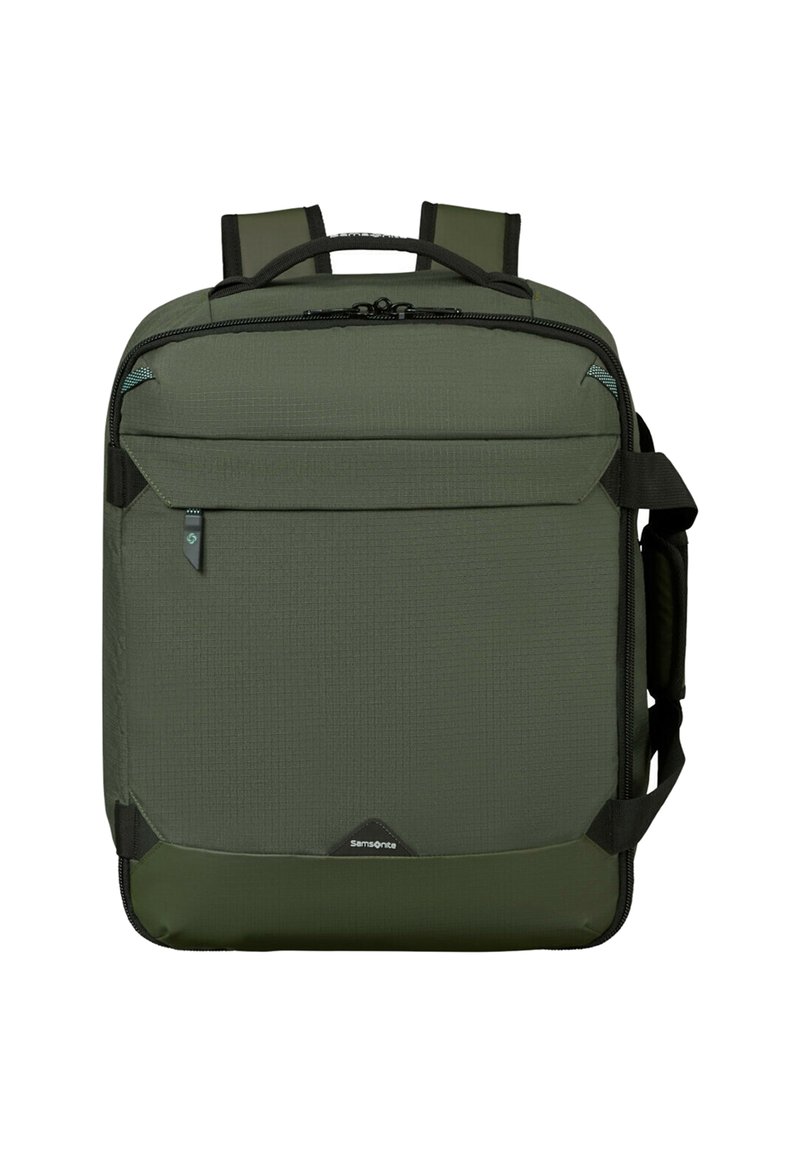 Grön Samsonite fyrkantig ryggsäck med vadderade remmar, framficka med dragkedja och sidhandtag mot vit bakgrund.