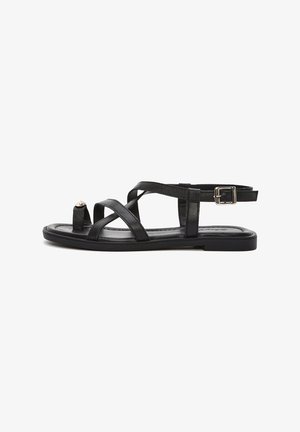 Black leather sandal with multiple crossed straps, open toe, and ankle strap featuring a metallic buckle. Flat sole, smooth texture.