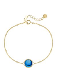 Zlato obarvana zapestnica z osrednjim modrim okroglim kamenjem, zasnovana z občutljivo verigo in majhnimi kovinskimi poudarki. Nastavljiv detajl zaponke.