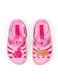 Rosa Plastiksandalen mit einem Riemen-Design. Mit Verzierung von einem Flamingo und einem Seestern. Strukturierte Sohle und verstellbarer Riemen.