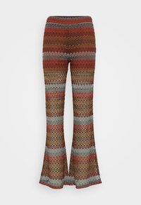 Stickade utsvängda byxor med horisontella ränder i rost, brunt och grått. Öppen vävstruktur med en elastisk midja för komfort.