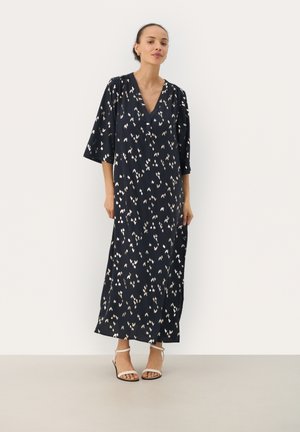 Navy long dress with a V-neck, dropped sleeves, and a floral pattern in cream and pale green. Made of lightweight fabric.