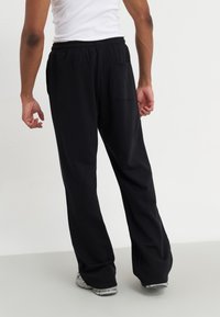 YOURTURN UNISEX - Dresside alumine osa - black
