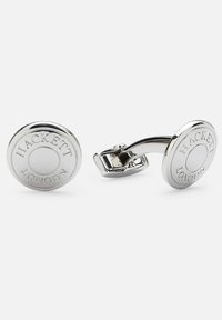 Silver-tone cufflinks with a circular shape, featuring engraved "HACKETT LONDON" text and a polished finish. Smooth texture and streamlined design.
