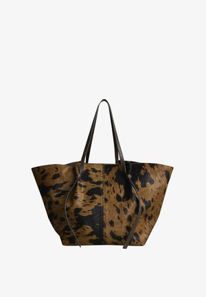 Large tote bag with brown and black cowhide pattern and dark brown leather handles against white background.