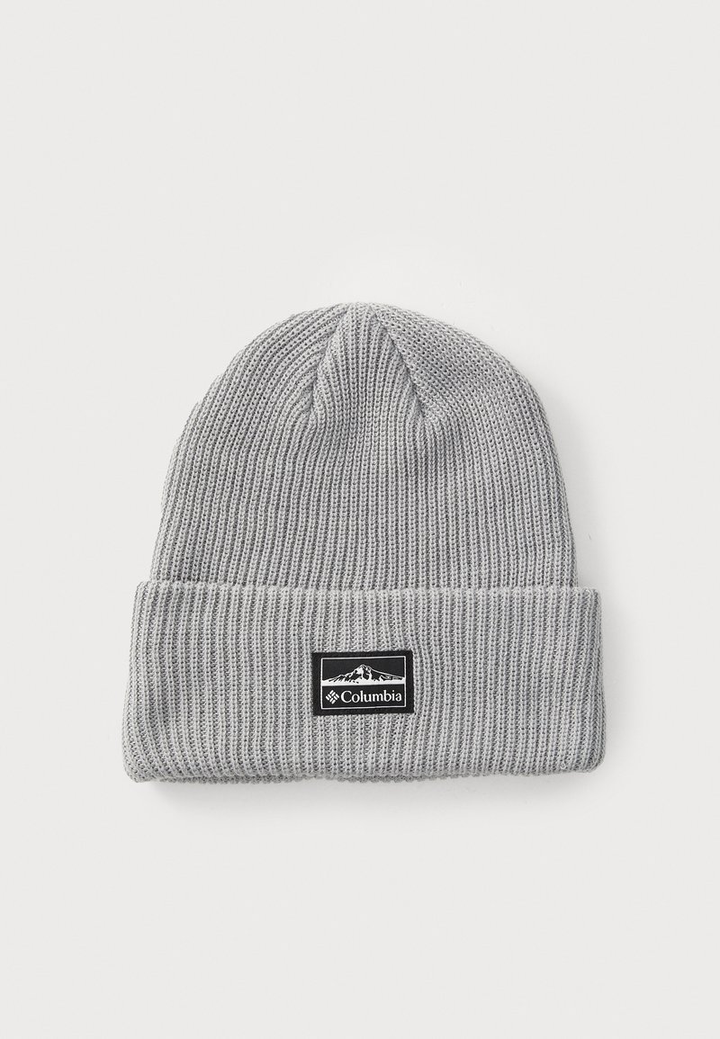 Gray ribbed knit beanie with a fold-over cuff, featuring a black rectangular tag with white logo and mountain graphic. Soft, stretchy material.
