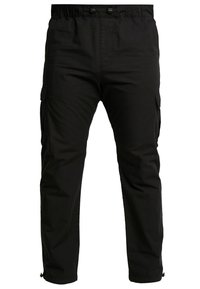 Schwarze Cargo-Hose aus gewebtem Stoff mit seitlichen Taschen, elastischem Bund und verstellbaren Bündchen. Einfaches, funktionales Design.