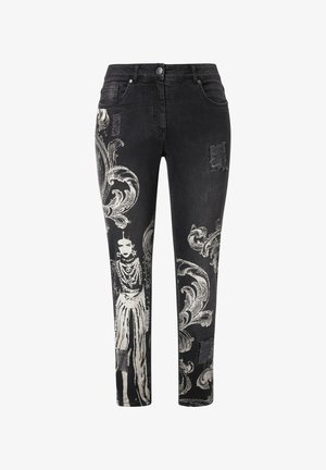 Jeans in denim nero con motivi bianchi ornati e un design grafico prominente, dettagli strappati e una vestibilità dritta.