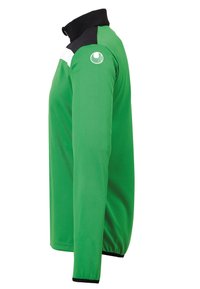 Grøn langærmet jakke med høj krave. Har sorte detaljer ved kraven og skulderen, samt en hvid stribe over brystet.