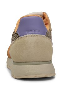 Stylish sneaker with beige suede and textured mesh upper, orange and purple accents, padded collar, and rubber outsole. Features logo on heel.