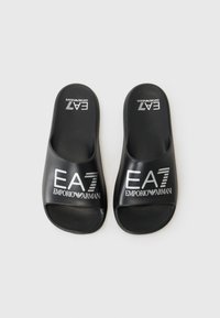 Black rubber slide sandals with open toe design. Features white EA7 and Emporio Armani branding on the footbed. Smooth texture.