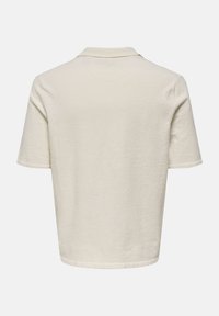 Kurzärmliges, kragenloses Hemd in Off-White, aus einem strukturierten Stoff mit geradem Schnitt und einem sauberen Saum in der Taille.