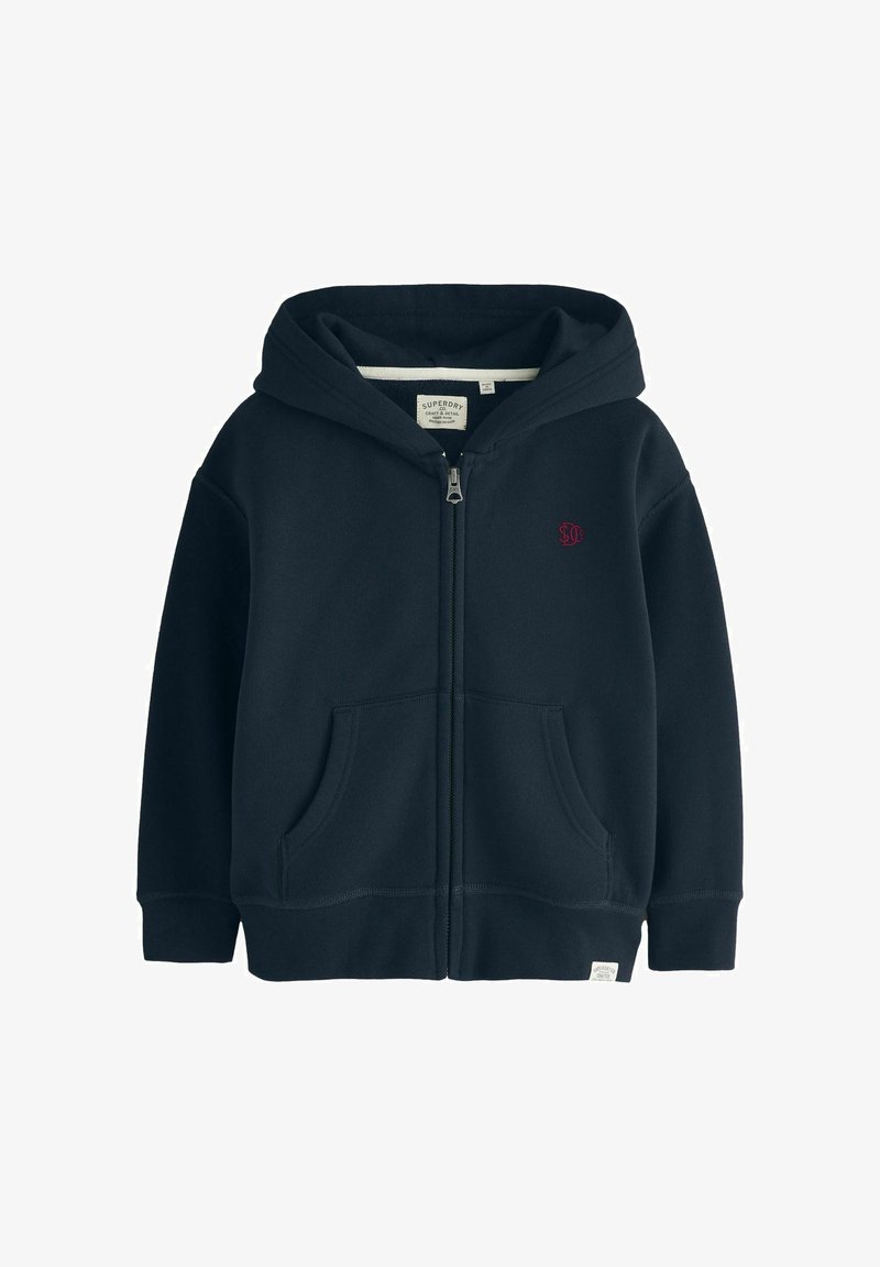 Sweat à capuche zippé bleu marine avec poches avant, capuche, petit logo brodé sur la poitrine gauche et étiquette en tissu près de l'ourlet inférieur.