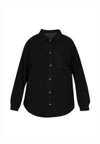 Camicia nera con bottoni, realizzata in un tessuto testurizzato, dotata di colletto, maniche lunghe e una tasca sul petto. Orlo arrotondato con bottoni marroni.