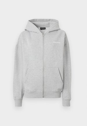 Grey zip-up hoodie made of soft fabric. Features a front pocket, ribbed cuffs, and a hood. Small logo printed on the chest.