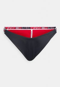 Parte de baixo de biquíni preta com interior vermelho, faixa branca e vermelha com a marca "TOMMY JEANS", textura suave e design de cobertura mínima.