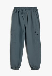 Pantalones cargo en una mezcla de algodón gris oscuro, con una cintura elástica, puños ajustados y dos bolsillos laterales. Textura suave.