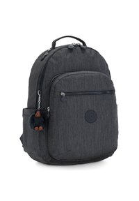 Dark gray fabric backpack with a rounded shape, zippered compartments, and a furry monkey keychain attached to the front pocket.