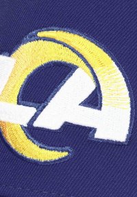 Embroidered patch featuring a white "EA" logo with a yellow arc, set on a dark blue fabric background. Textured yarn detail evident.