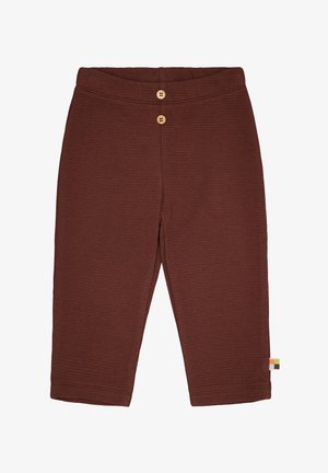 Braune, gerippte Kinderhose mit einem breiten Bund, zwei Holzknöpfen vorne und einem kleinen mehrfarbigen Etikett an der Seite.