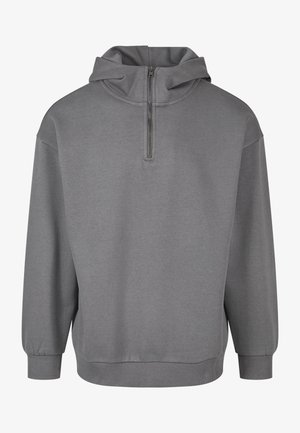 Szürke kapucnis pulóver félzipzárral az elején, hosszú ujjak, bordázott mandzsetták és puha, texturált anyag. Egyszerű dizájn, minta nélkül.