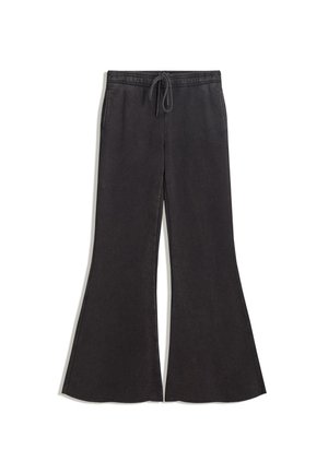 Pantaloni in felpa neri svasati con vita regolabile. Tessuto morbido, gambe larghe e stile informale. Nessun motivo o decorazione visibile.