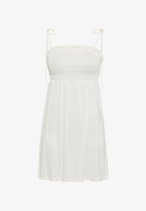 Abito estivo bianco senza maniche con corpetto arricciato e sottili laccetti sulle spalle, lunghezza al ginocchio con gonna ampia e fluente.