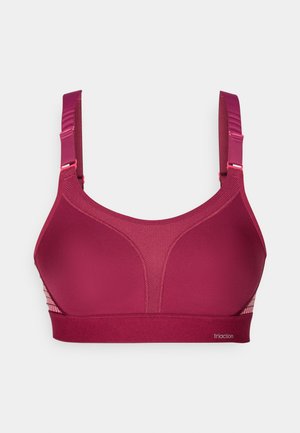 Mahlala-liknande sport-BH i djup burgundyröd, med ett slätt ogenomskinligt tyg, nätpaneler för andningsförmåga och justerbara axelremmar med rosa detaljer.