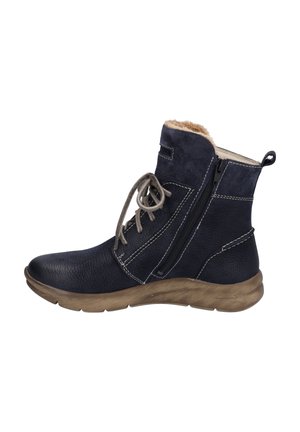 Bottines en cuir bleu marine avec une finition texturée, doublure en fourrure beige, fermeture éclair sur le côté, lacets gris et semelle en caoutchouc marron clair.
