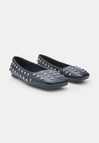 Blue leather flats with a pointed toe, adorned with silver studs across the surface, featuring a flat sole and slip-on design.