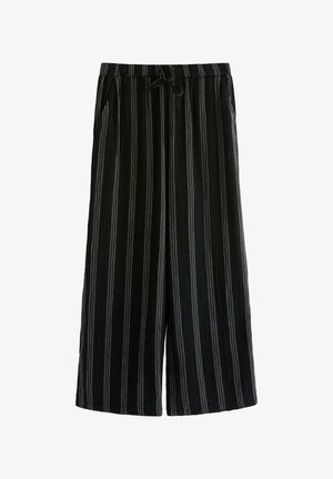 Pantalons large en rayures noires et blanches avec une taille à cordon, présentant une texture douce et deux poches latérales.