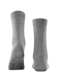 Pair of plain grey crew socks shown from heel view on white background, with subtle text on sole of left sock.