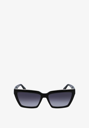 Mustad mustreaksed päikeseprillid, millel on hallide gradientläätsed. Raami ülaosas on hõbedane aksent. Sile plastikuline tekstuur, tugevad käed.