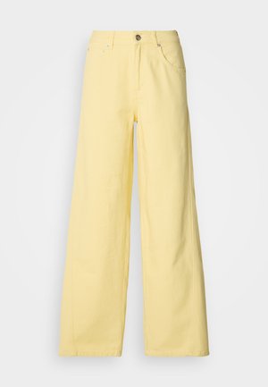 Yellow wide-leg pants made of cotton with a high waist, featuring a metal button closure and two front pockets. Smooth texture, minimal stitching.