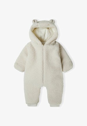 Combinaison pour bébé en polaire blanche avec capuche ornée d'oreilles d'ours, fermeture éclair à l'avant et poignets élastiqués. Tissu doux et texturé avec un design confortable.