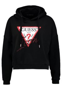 Černá zkrácená mikina s kapucí a červeným trojúhelníkovým logem s nápisem "GUESS U.S.A." a dekorativním "?". Obsahuje šňůrky na stažení a žebrované manžety.