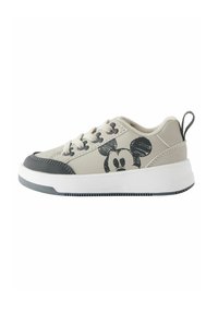Light gray sneaker with black accents, featuring a printed Mickey Mouse design, round toe, textured grip sole, and lace-up closure.
