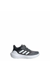 Gray sneaker with a mesh upper, black accents, and three white stripes. Features a cushioned sole and a secured strap closure.