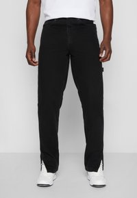 Karl Kani RETRO SLIT PANTS - Calças de ganga de perna direita - black