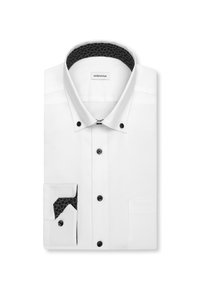 Chemise blanche pour homme avec boutons noirs, col boutonné, col intérieur noir à motif et détail intérieur de manchette assorti, pliée soigneusement.