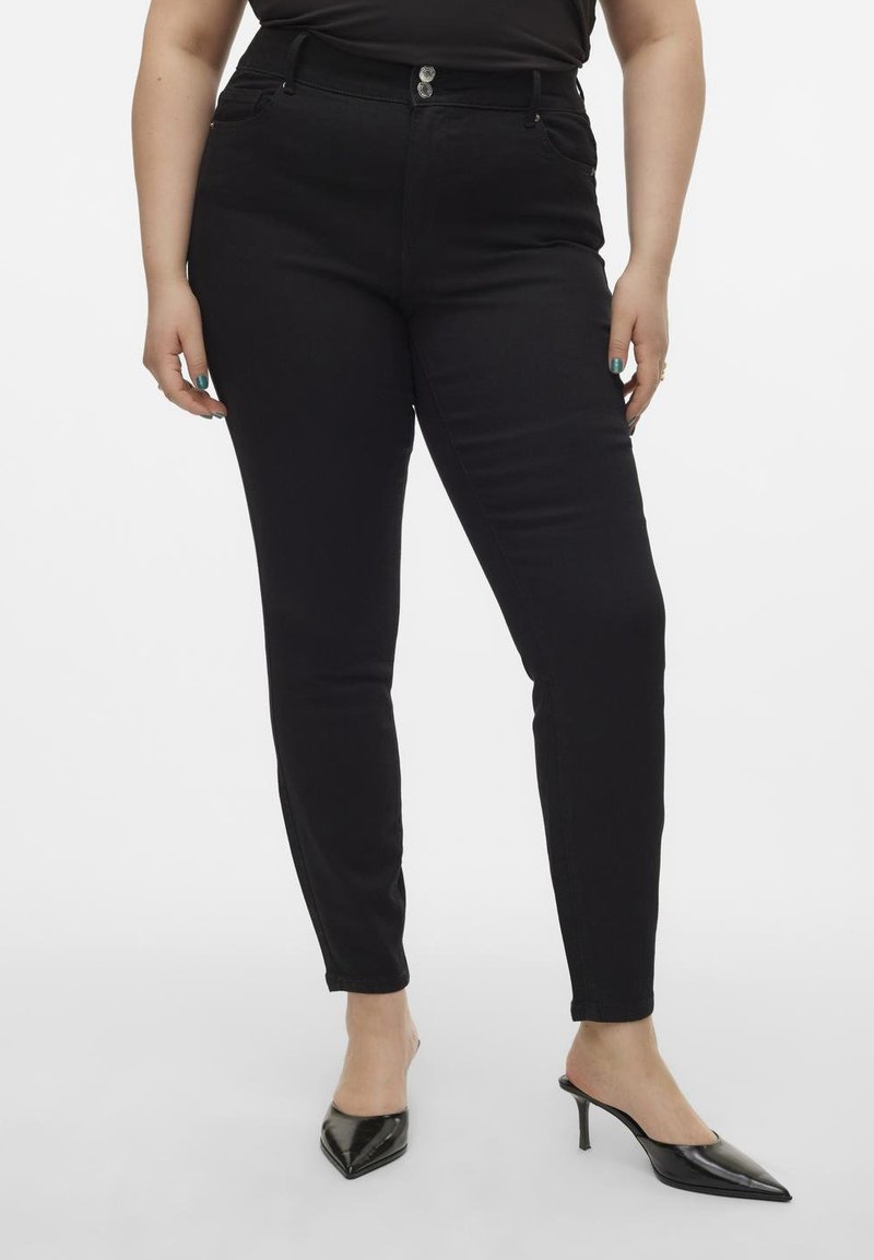 Svart skinny jeans med hög midja, med en stängning med två knappar, bältesöglor och framfickor. Slät denimtyg och åtsittande silhuett.