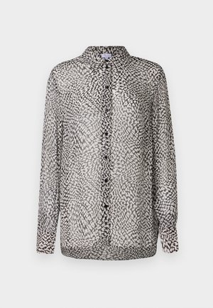 Gjennomsiktig svart og hvit bluse med knappefront, lange ermer og et abstrakt mønster med varierende teksturer.