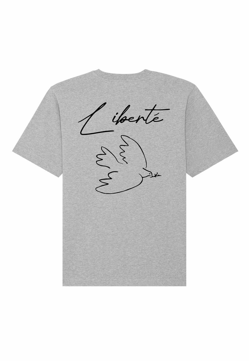 Grijs T-shirt met korte mouwen, met een zwarte lijntekening van een duif die een tak vasthoudt, en het woord "Liberté" erboven.