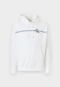 Witte hoodie met een trekkoord capuchon, voorzak en een blauwe Calvin Klein logo stripe over de borst. Zacht katoen materiaal.
