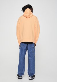 PULL&BEAR Jersey con capucha - burnt orange denim