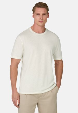 Lys beige crew-neck T-shirt lavet af blødt stof, med korte ærmer og en afslappet pasform. Ingen synlige mønstre eller accenter.