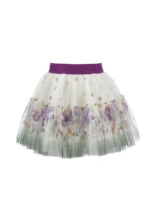 White tulle skirt with purple polka dots, floral print hem, and elastic purple waistband embossed with brand name.