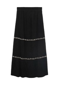 Black maxi skirt with a tiered design, featuring white decorative stitching along the seams and an elastic waistband for easy wear.