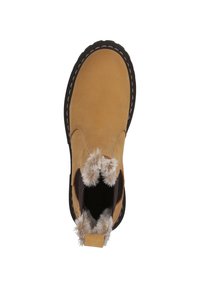 Bottine en cuir tan avec doublure en fourrure au niveau du cuff, semelle en caoutchouc noire et détails de couture contrastants le long du bord.
