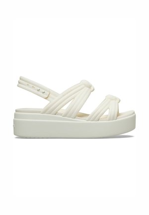 Sandale plateforme blanche avec brides rembourrées et bride arrière ajustable, dotée d'une semelle épaisse et d'un design moderne et simple.